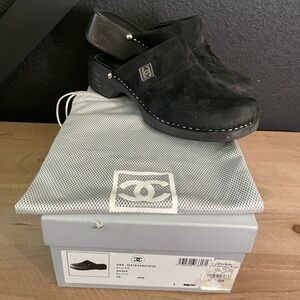 CHANEL Women’s Black Suede CC Clogs